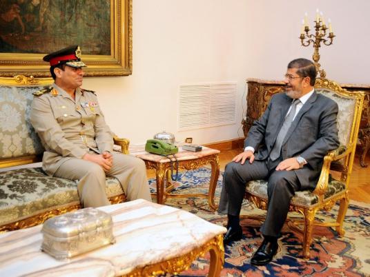 مرسي والسيسي في لقاء سابق
