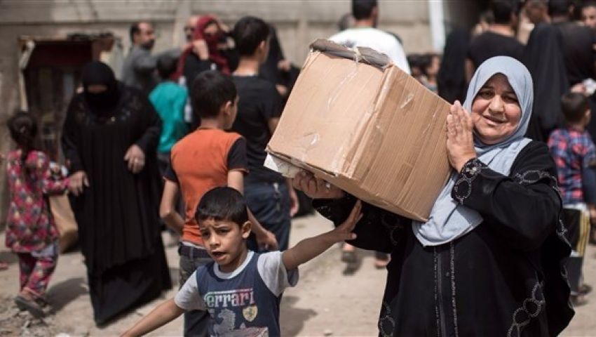 المئات يفرون من الموصل.. ومعارك ضارية مع داعش